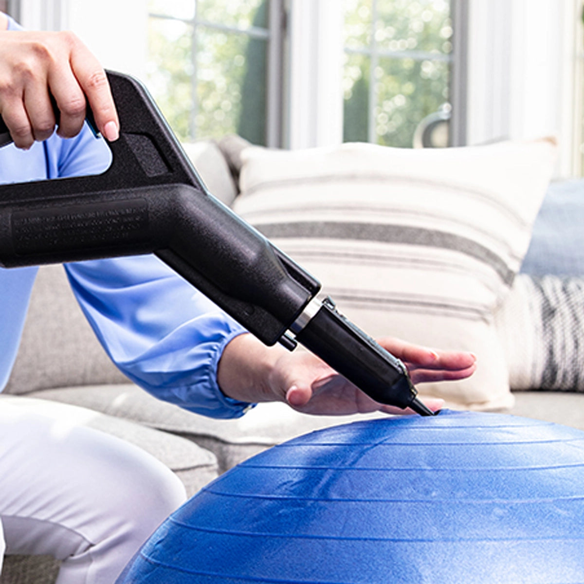 Inflator Tool Attachment blowing up an exercise ball